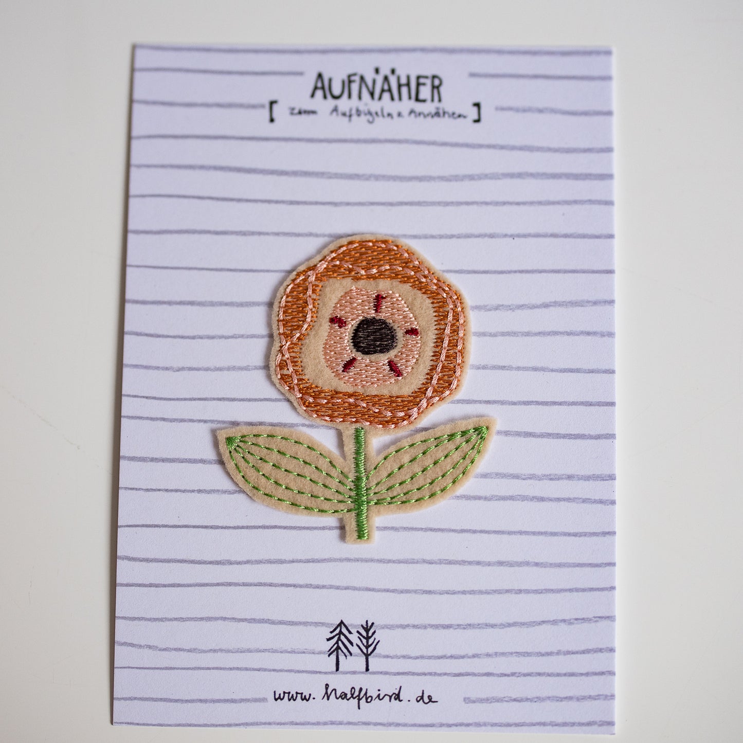 Strykelapp oransje blomst