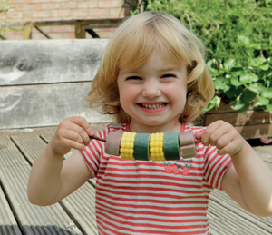 Sensory play stones - Threading Kebabs